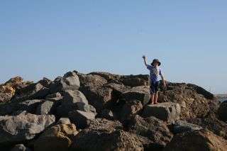 kid on rocks